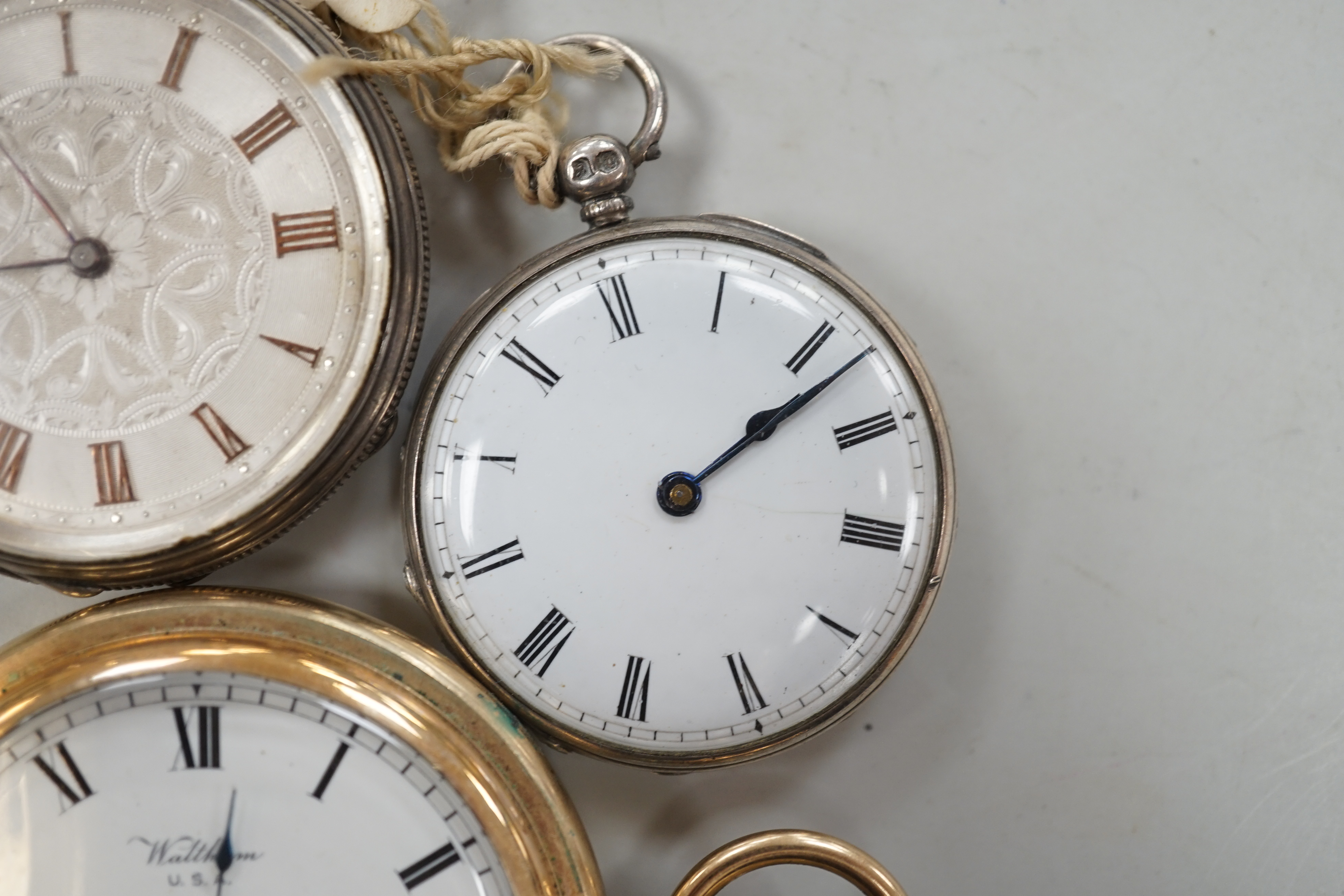 A Waltham gold plated hunter pocket watch and two fob watches, one silver.